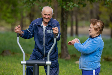 senior couple practicing exercise outdoors