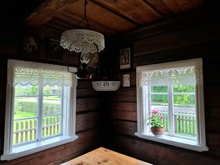  The windows is divided into multiple glass panes, and the paint on the frame shows signs of wear over time. 