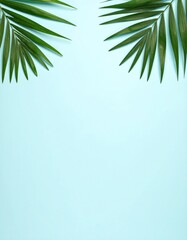 Green palm leaves on light blue background. Minimalist composition and copy space. Flat lay, top view. Ideal for invitations