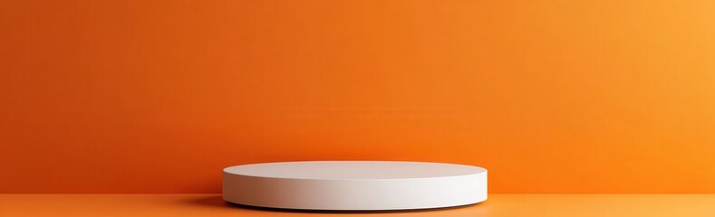 Obraz premium White circular podium on vibrant orange background ideal for product presentation and advertising