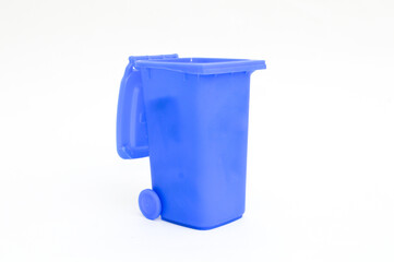 Rubbish bin garbage square shape dark blue with flip cover and casters isolated on white background. Waste collection equipment in park.