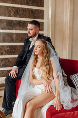 happy bride and groom in the lobby of the hotel on the day of the wedding