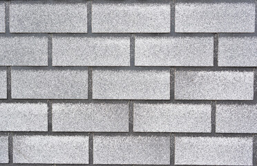 a close up of gray brick wall
