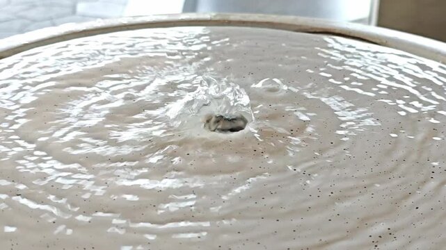 Close up decorative fountain pouring water.