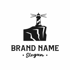 A classic black and white logo featuring a lighthouse silhouette on a rocky cliff, with placeholder text for a brand name and slogan.