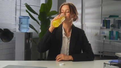 Business Professional Enjoying Refreshing Beverage at Work