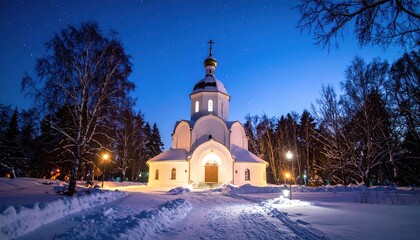 Fototapeta premium Snowy winter church at night