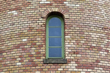 brick wall with narrow window