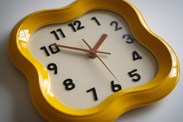Yellow Decorative Clock with Unique Design and Bold Numbers