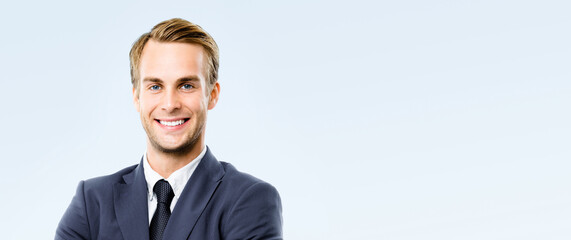 Portrait - happy smile business man in corporate suit, white shirt, tie, stand on grey gray background. Businessman, bank manager, lawyer, teacher, sales agent. Banner image with free ad text space.