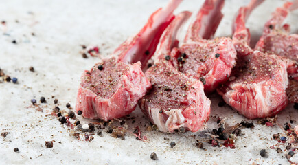 Raw lamb ribs seasoned with various spices
