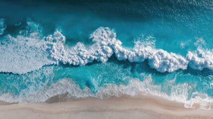 Turquoise Wave's Majestic Crest: An Aerial Top-Down View of Surf on a Sandy Beach