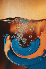 Bubbles rising in liquid abstract art with blue and orange colors.