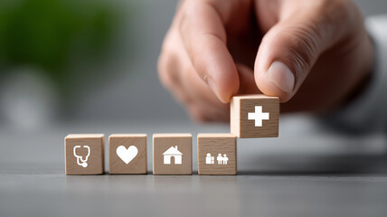 Hyper realistic close up of male hand placing wooden building blocks with glowing medical icons stethoscope heart hospital cross and family symbol symbolizing healthcare planning and insurance securit