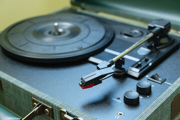 Close up of a spinning vinyl record on a turntable, evoking nostalgia and vintage atmosphere