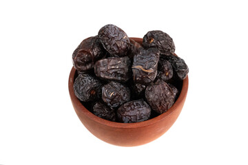 A small terracotta bowl is completely filled with dark, dry dates.