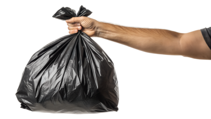 A hand holding a black trash bag isolated on a white background