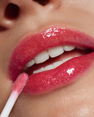 Naklejka premium Glossy Lip Application with Soft Pink Shine on Smooth Lips