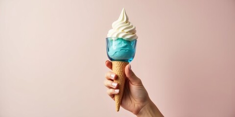 Creative Blue Ice Cream Cone Held Against Pink Background