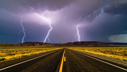 Dramatic lightning storm over a long, straight highway