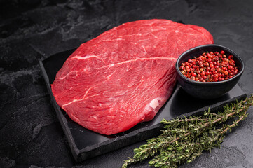 Juicy raw top sirloin cut, highlighting its marbling and freshness, perfect for your next barbecue or dinner party. black background. top view