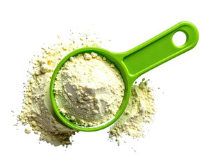 Bright green measuring scoop filled with pale yellow flour, scattered around