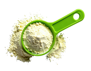 Bright green measuring scoop filled with pale yellow flour, scattered around