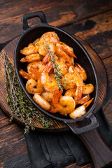 Deliciously seasoned grilled shrimp prawns with vibrant colors, a must-have for seafood lovers and culinary enthusiasts. wooden background. top view