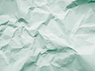 Obraz premium Green background crumpled paper scrapbook empty abstract backdrop, texture wrinkled card grunge sheet cardboard rough letter newspaper mockup cosmetic or eco system environment change natural.