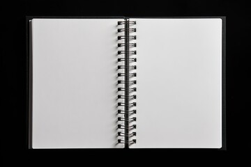 Open spiral-bound notebook with blank pages.  Black cover, white pages.  Metal spiral binding.  Flat lay