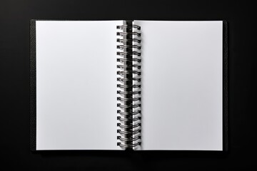Open spiral-bound notebook, blank pages, black cover