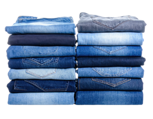 Two stacks of folded denim jeans in various shades of blue