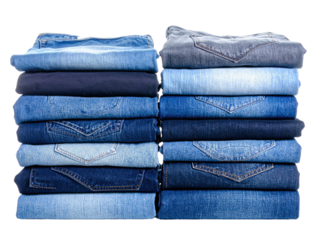 Two stacks of folded denim jeans in various shades of blue