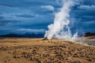 View on Hverir geothermal area with boiling mudpools and steaming fumaroles, Iceland