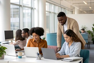 Group of people are working on laptops in a cubicle