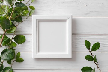 White frame surrounded by greenery on white wood