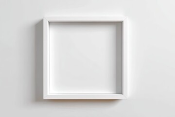 Blank white picture frame on a plain white wall