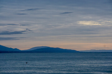 The sky is a beautiful shade of blue with a few clouds scattered throughout