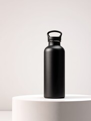 Matte black water bottle on a white pedestal