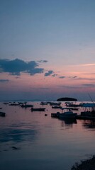 Naklejka premium Footprints on the beach at sunset