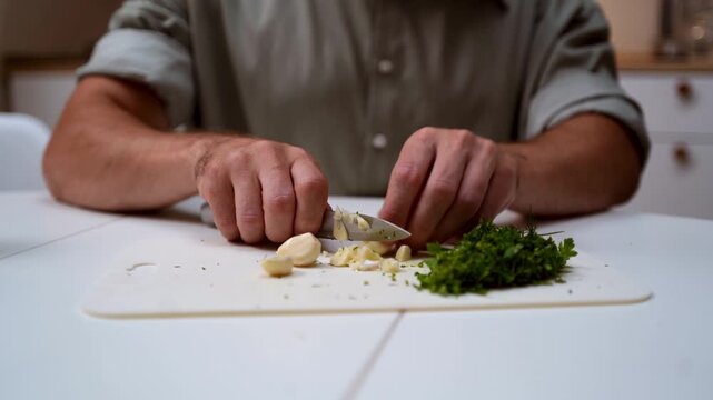 A chef professionally prepares a fresh vegetable salad, chopping potatoes, eggs, and greens. Dynamic cooking process showcasing culinary skills and healthy food preparation