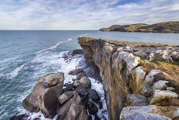 View from rocks on Ajo cape over Bay of Biscay of the northeast Atlantic Ocean in Cantabria, Spain