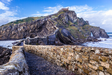 Manmade way to small isle with San Juan de Gaztelugatxe hermitage on the Atlantic shore in Biscay region of Sapin