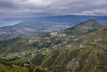 Aerial view on a green hills around Castelmola, small town on Sicily Island, Italy