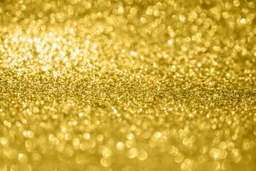 Abstract gold glitter sparkle texture with bokeh background