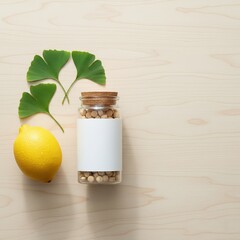 A glass jar mockup with herbal tablets sits beside a fresh lemon and green ginkgo leaves on a light wooden surface.