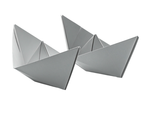 Two light gray paper origami boats angled, close-up view - Powered by Adobe