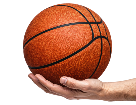 A basketball held in a hand against a black background