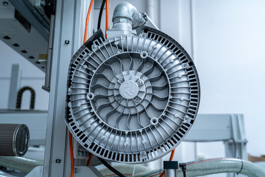 Industrial radial fan blower, metallic engineering detail, workshop