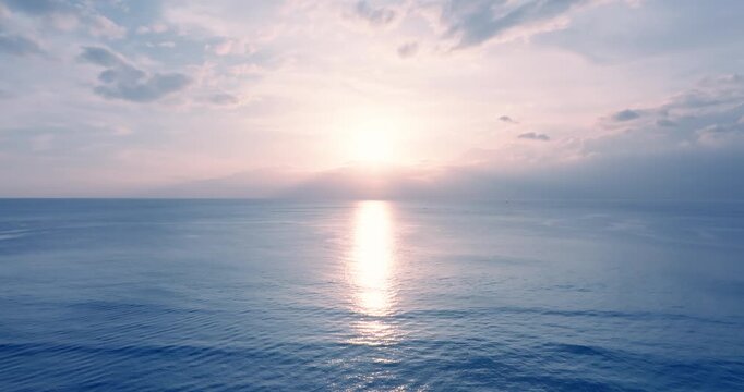 Aerial view scene of sunset over the sea sky horizon